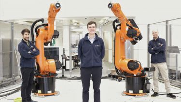 Gianmarco Pisanelli with three colleagues in the Robotic Winding Cell