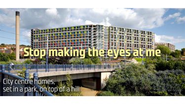 View of revitalised parkhill flats with "Stop making the eyes at me" written across it