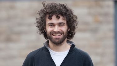 Picture of Tom looking at camera smiling