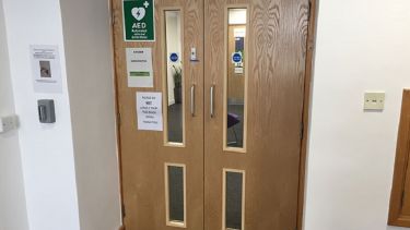 A photo of Cathedral Court showing the location of a defibrillator.