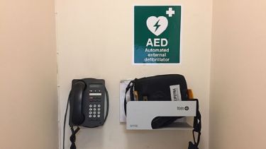 A close-up of the automated external defibrillator in the Dainton Building.