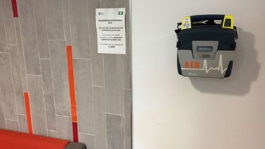 A close-up of the automated external defibrillator in Hadfield Tower.