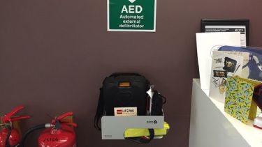 A close-up of the automated external defibrillator in Halifax Hall.