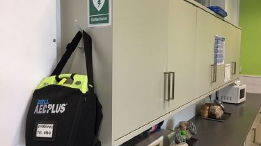A close-up of the automated external defibrillator in the Mappin Complex Broad Lane Block.