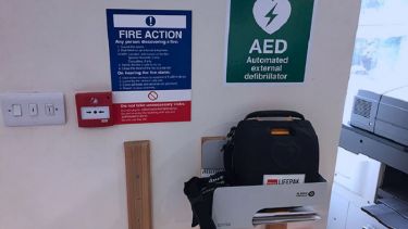 A close-up of the automated external defibrillator in North Campus.