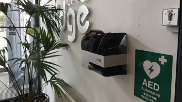 A close-up of the automated external defibrillator in The Ridge.