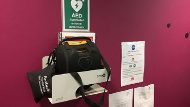 A close-up of the automated external defibrillator in 3 Solly Street.