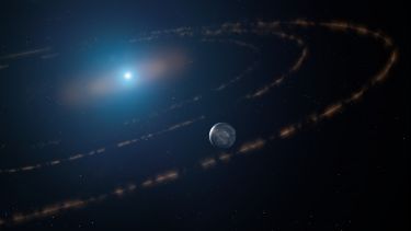 An artist’s impression of the white dwarf star WD1054–226 orbited by clouds of planetary debris and a major planet in the habitable zone.