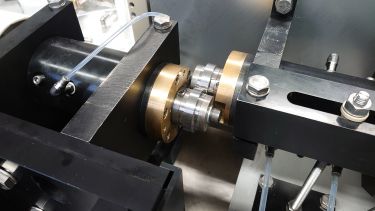 Rail and wheel test samples undergo twin-disc testing