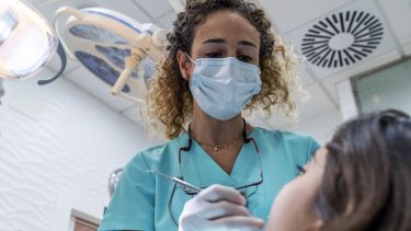 Female Dentist and young patient