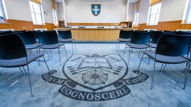 Moot Court room set up with chairs facing the front