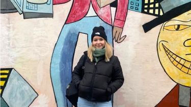 Ellie standing in front of street art in Utrecht