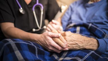 Hospice Nurse visiting an elderly male patient