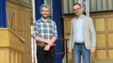 Photo of PhD student Spencer Moore and Professor Ivan Minev 