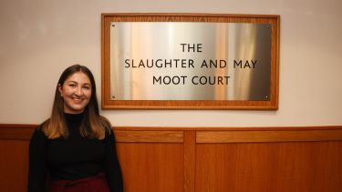 Photograph of School of Law Alumni Jess Edwards standing outside the Moot Court