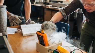 Physics students performing an experiment in a teaching laboratory