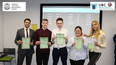 An image of the 2022 UBC team holding their certificates.