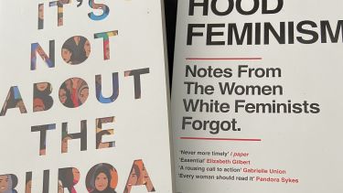 A photo of two books, "It's Not About the Burqa" and "Hood Feminism"