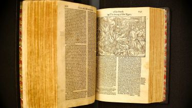 An image of an open book written in old English