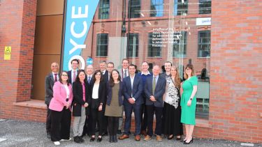 VIP guests in front of Royce Discovery Centre