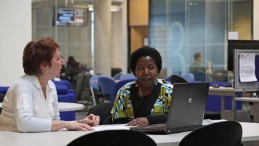 A student and tutor in the Department for Lifelong Learning 