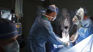 Surgeon performing robotic surgery