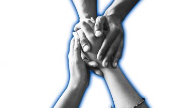 images shows two sets of hands holding in a supportive way.