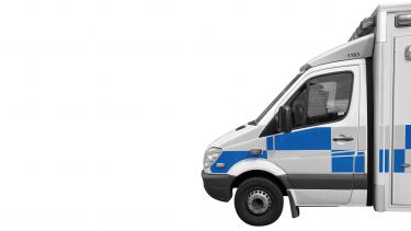 picture of the front end of a UK ambulance taken from the side of the vehicle