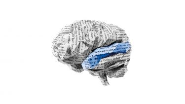 Brain made from paper with words written on it