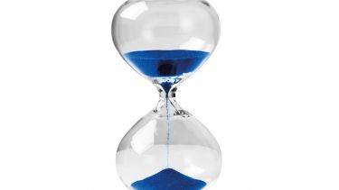 A picture of an hourglass with blue sand