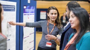 Student presenting their work at a research conference