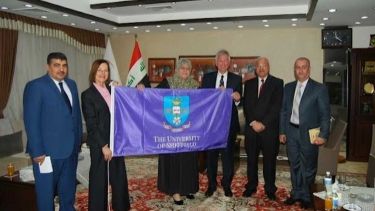 Nigel and Deborah Bax Presenting HE Professor Adela Hussein with a University of Sheffield flag