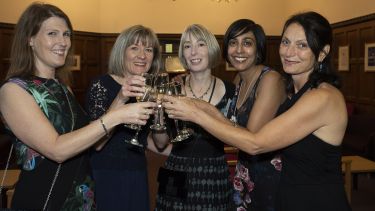 A group of alumni attending the Annual Alumni Reunion 2019 having a toast