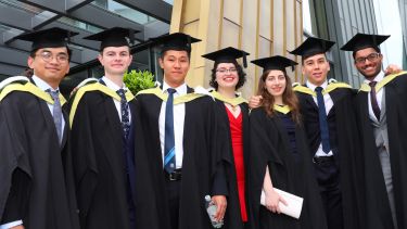 Line of graduates outside