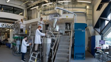 Students and staff working on equipment in the Diamond Pilot Plant