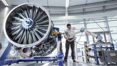 An engineer working on a jet engine in the University of Sheffield AMRC