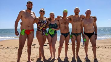 Alicia Thompson and her team in swimming gear