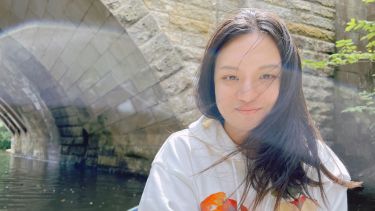 Sebastian Zhang sitting on a boat
