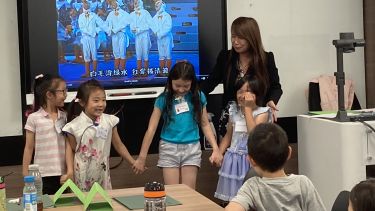 Teacher Guo with students in Language & Literature class