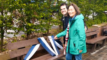 Photo of Tim and Ping Bradshaw cutting the ribbon