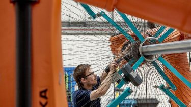 Man works on giant wheel at AMRC