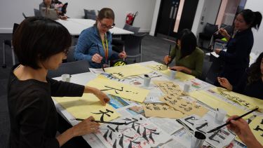 Students under instruction from Tao Ting 