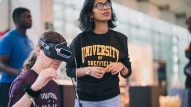 Two people enjoying a VR experience at a previous Festival of the Mind event