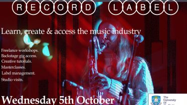 Poster event with bass clarinet player in background