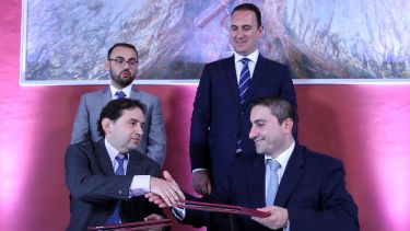 Dr Miguel Debono shakes hands with Mr Matthew Vella