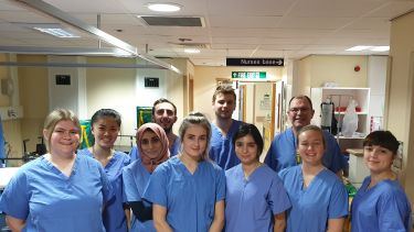 Group of medical students in blue scrubs