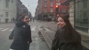 Politics student Caitlin riding a bike in Copenhagen