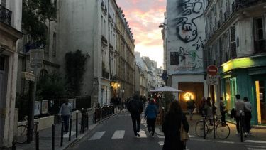 Street corner in Paris, Graffiti on walss, cafe's and bars open