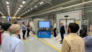 Photograph of delegates taking part in a tour of Factory 2050 at the FEMM Hub 2022 conference