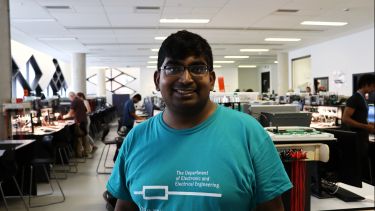Photograph of Nathan standing in the Electronics and Control Lab at the University of Sheffield, where the taster session was held